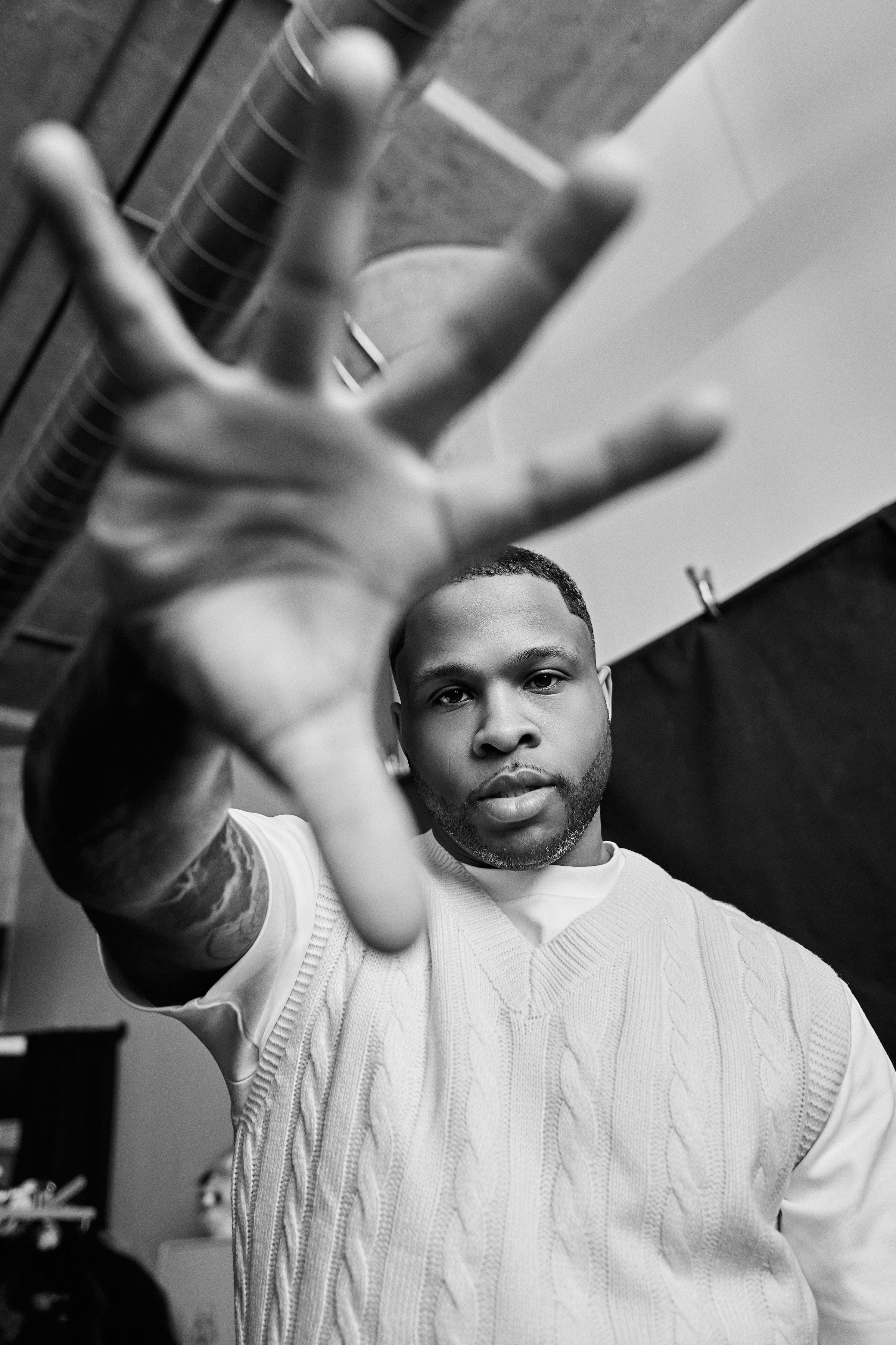 Dion reaching toward the camera in a portrait session